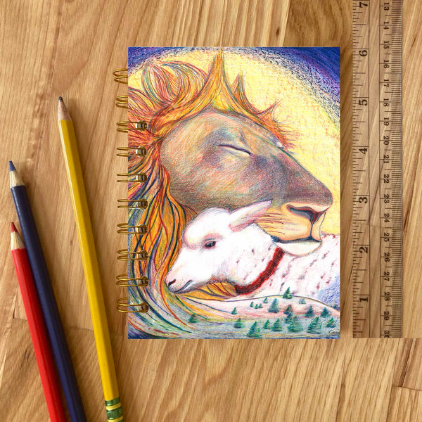 Journal with a colorful cover illustration of a lion and lamb 